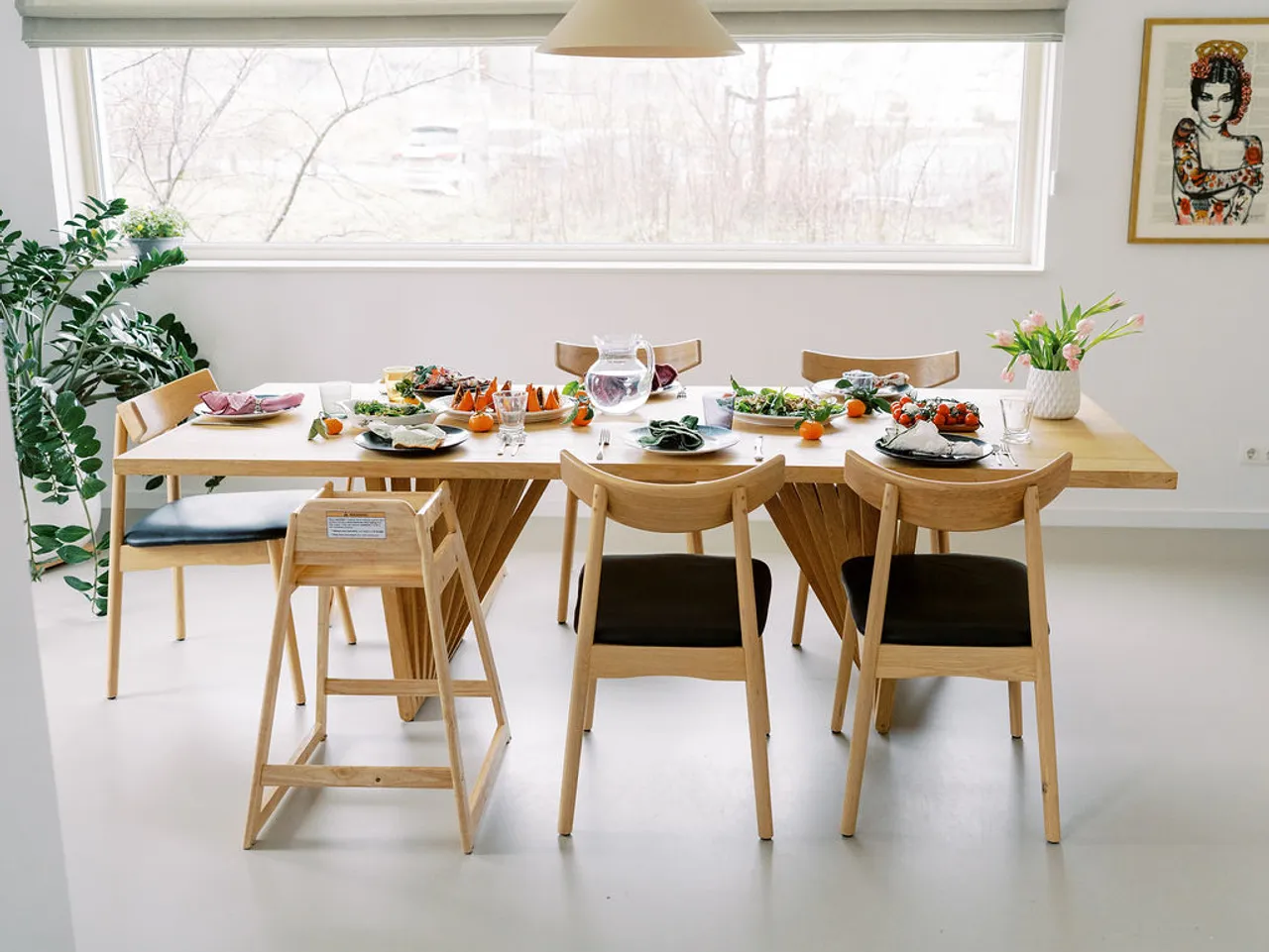A family seated around a dinner table sharing a meal