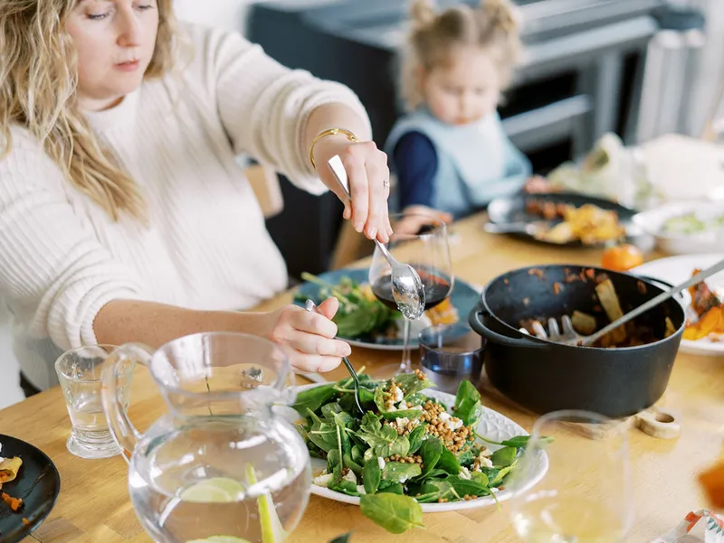 Families sharing a home-cooked meal at a table